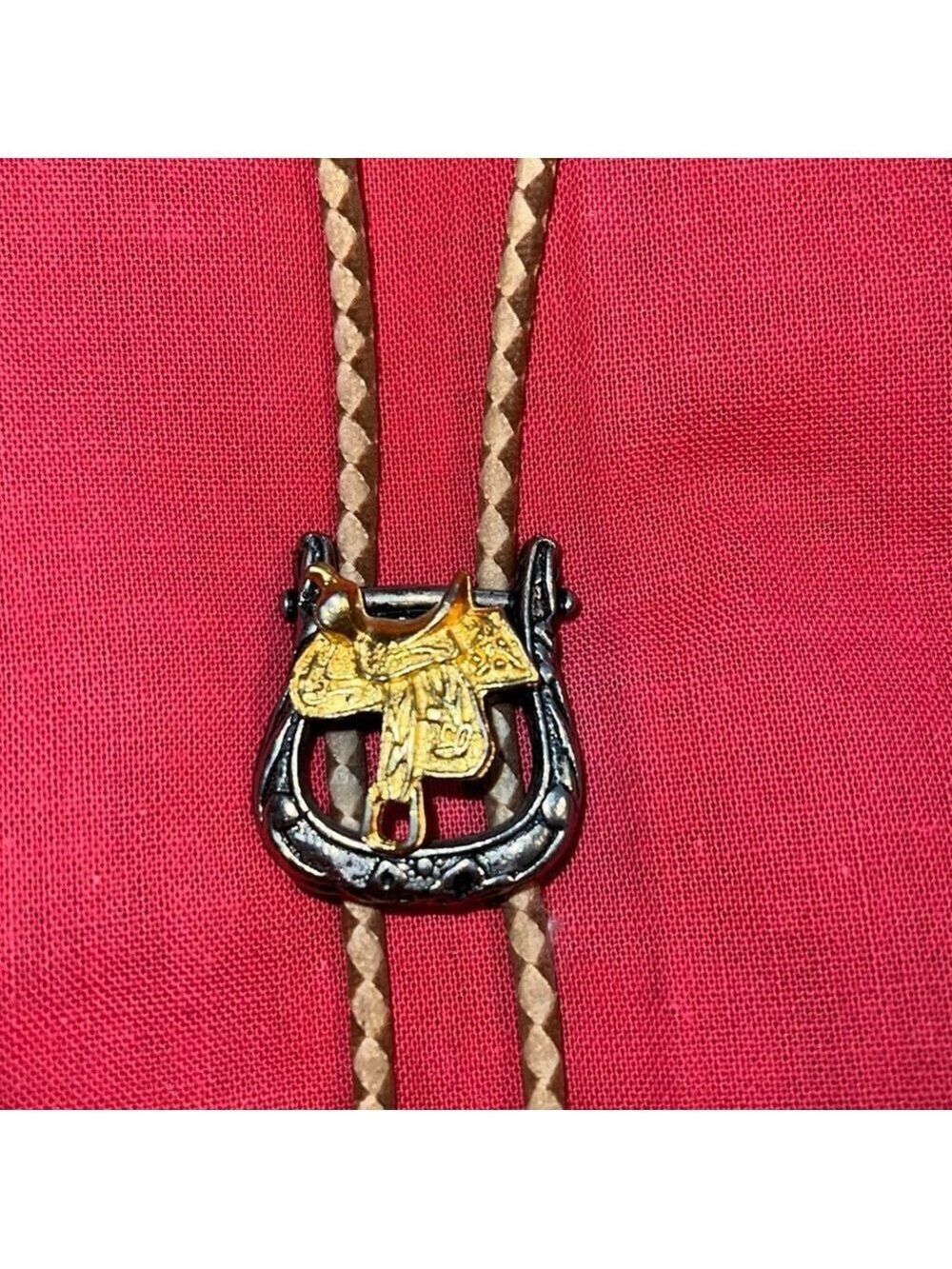 Bolo tie, western motif with saddle.